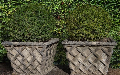 A pair of stone composition planters modelled as baskets