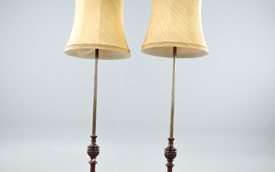 A pair of wooden and yellow metal floor lamps, 20th century.