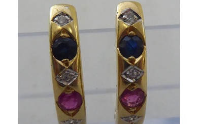 A pair of yellow metal, half-loop earrings, set with rubies,...