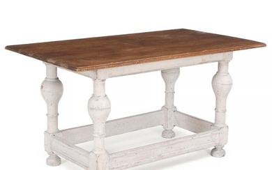 A partially painted Swedish pinewood table with carved edge and ball-shaped legs....