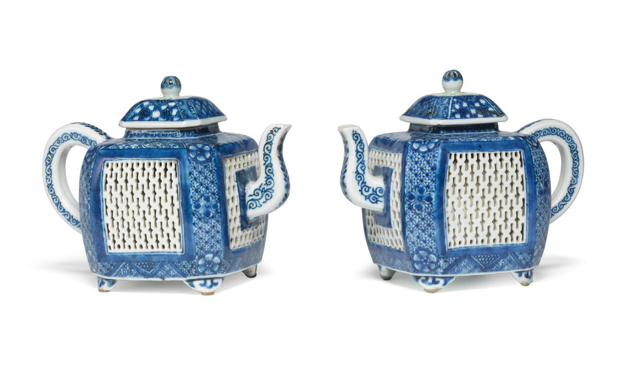 A rare pair of blue and white teapots and covers
