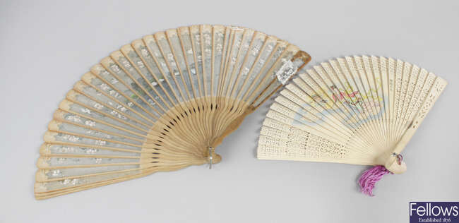 A selection of fans, to include an antique ladies' folding hand held fan, with pierced horn shaped vanes, further decorated with a painted scene depicting a young boy seated upon the back of a dog, etc.