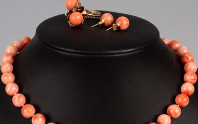 A set of coral necklace, earrings and ring