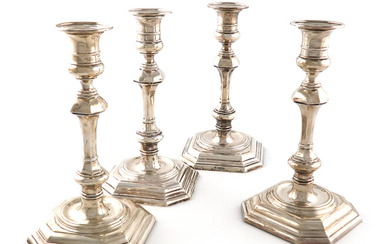 A set of four silver candlesticks