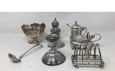 A silver sugar bowl, sifting spoon, a toast rack, two mustar...