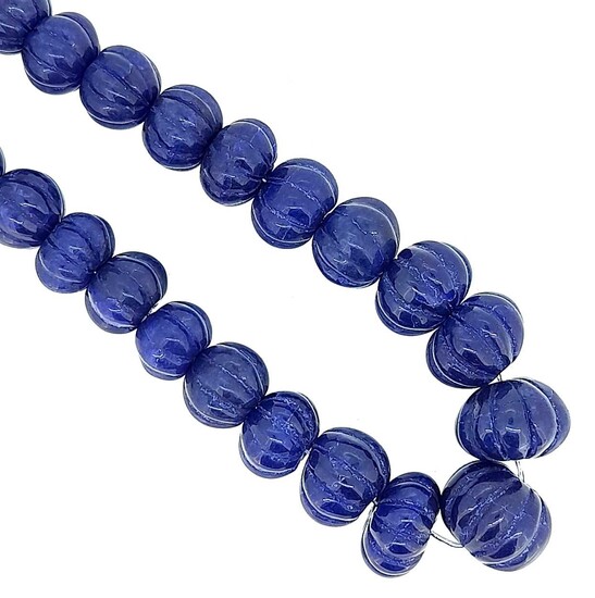 A single row of carved sapphire beads