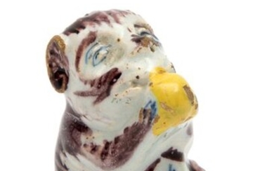 A small Delft polychrome pottery figure of a monkey