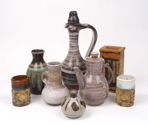 A small Lowerdown Pottery ovoid vase, 10cm high, together with a selection of other pottery wares including a ewer and cover, a tea pot and cover, two cylindrical Troika style vessels, a larger Troika style rectangular vase, a West German vase and...