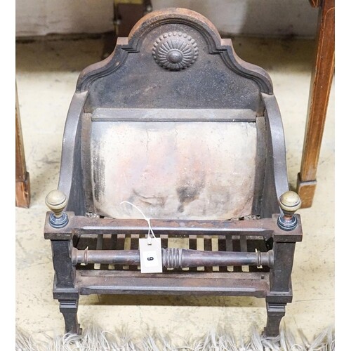 A small iron and brass fire grate, width 41cm, depth 26cm, h...