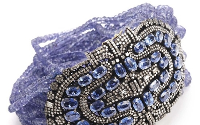 A tanzanite and diamond bracelet set with numerous pearls of tanzanite, faceted kyanites and single-cut diamonds, mounted in oxidized sterling silver.