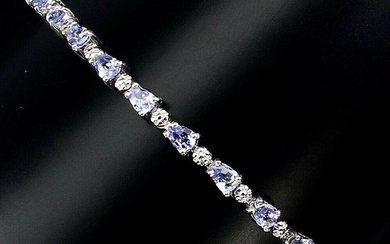 A tanzanite bracelet set with numerous pear-shaped tanzanites, mounted in rhodium plated sterling silver. L. 18.5 cm.