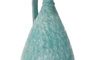 A turquoise blue-glazed pottery footed jug, Kashan, Central Iran, 12th century, of...