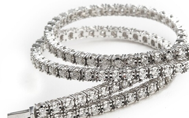 NOT SOLD. A two-strand diamond bracelet set with numerous brilliant-cut diamonds weighing a total of...