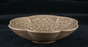 A very important and rare celadon glazed dish in the shape of a mallow flower