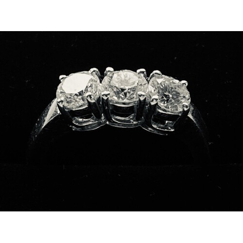 AN 18CT WHITE GOLD THREE STONE DIAMOND RING, 1.26 ct of the ...