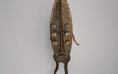 AN AFRICAN CARVED WOODEN GREBO 'LEAF FORM' MASK Having paint...