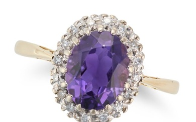 AN AMETHYST AND DIAMOND CLUSTER RING in 18ct yellow gold, set with an oval cut amethyst in a cluster