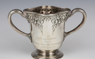 AN IMPORTANT STERLING SILVER TWO HANDLED CUP GIVEN BY
