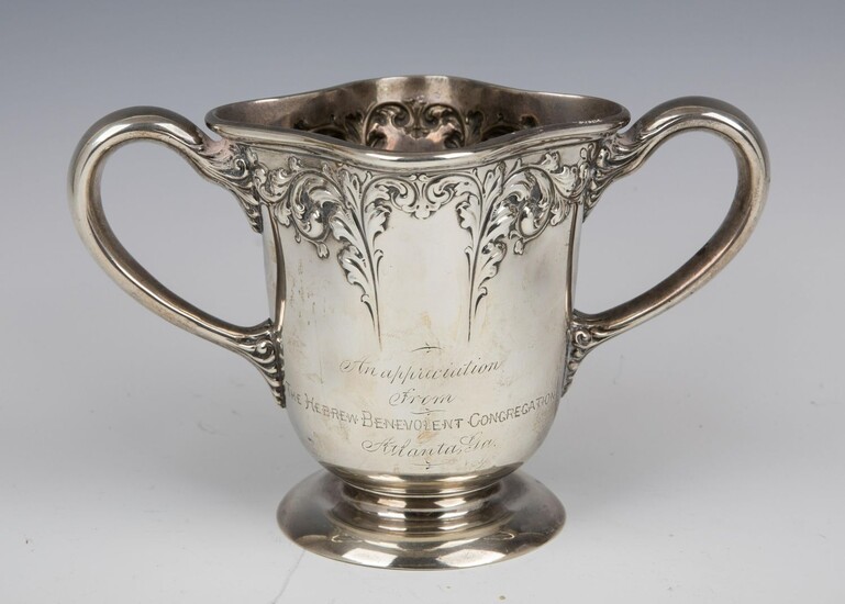 AN IMPORTANT STERLING SILVER TWO HANDLED CUP GIVEN BY