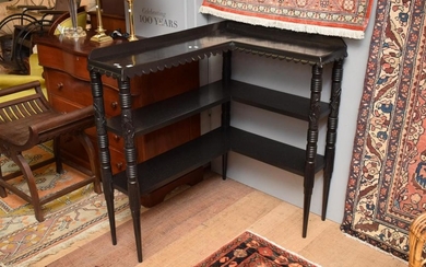 AN ITALIAN PERIOD CORNER BOOKCASE WITH CARVED LEGS AND FRETTED SHELVES