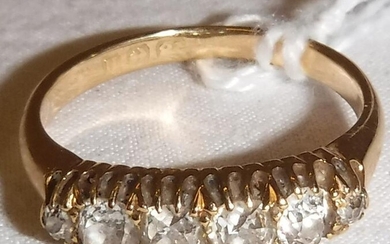 An 18 carat gold five stone diamond set ring,...