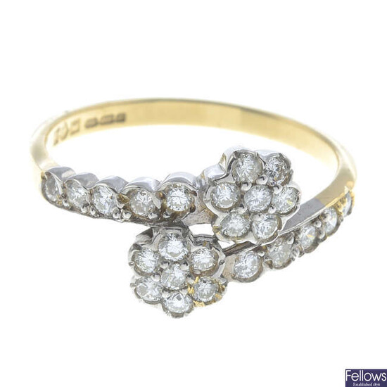 An 18ct gold brilliant-cut diamond double cluster crossover ring.