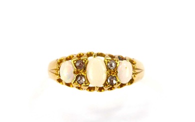 An 18ct gold ring set with three oval white opals,...