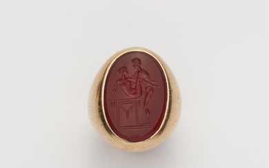 An 18k rose gold gentlemans' signet ring with a Neoclassical carnelian intaglio.