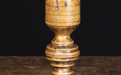 An 18th Century French Turned Treen Candlestick with ringed bulbous stem on a round moulded foot, Au