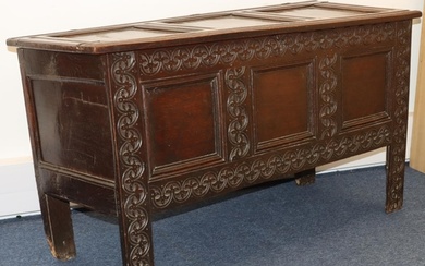 An 18th Century oak coffer with triple panelled front and ca...