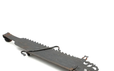 An 18th century iron fireplace hanger, engraved with ornamentation and indistinctly year,...