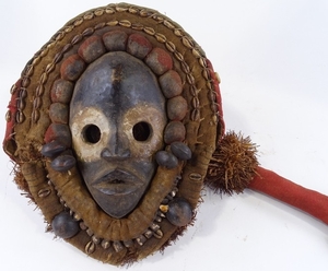 An African Dan carved wood and fabric shell-mounted stilt wa...