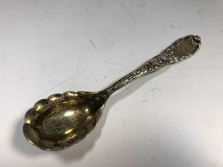 An American metalwares conserve spoon by Tiffany
