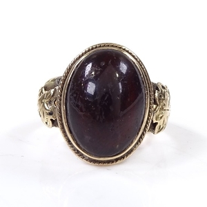 An Antique unmarked gold and cabochon red stone signet ring,...
