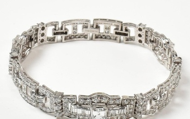 An Art Deco platinum and diamond bracelet. The bracelet havi...