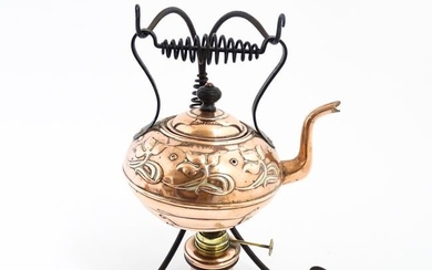 An Arts & Crafts Henry Loveridge & Co. copper kettle with copper and brass burner and cast iron