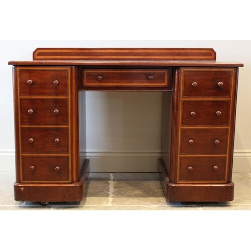 An Edwardian mahogany twin pedestal dressing table, the rect...