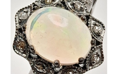 An Ethiopian Opal Ring with Rose Cut diamond Surround and Ac...