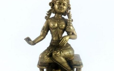 An Indian cast brass figure of the deity