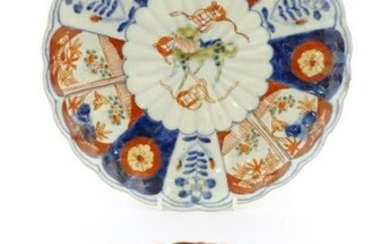 An Oriental plate in the Imari palette decorated with