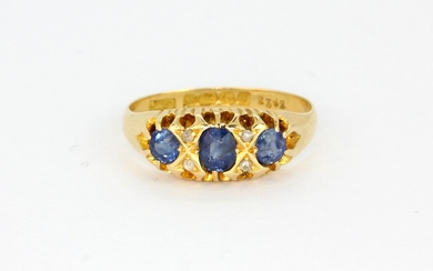 An antique 18ct yellow gold ring set with oval cut sapphires and diamonds, (Q).