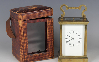 An early 20th century French brass cased carriage clock with eight day movement striking hours and h