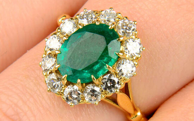 An emerald and old-cut diamond cluster ring.