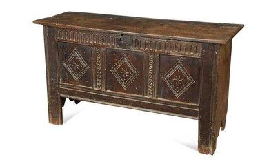 An oak coffer with three panel front, 17th century and later