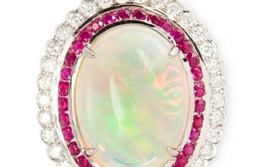 An opal, ruby, diamond and fourteen karat gold ring