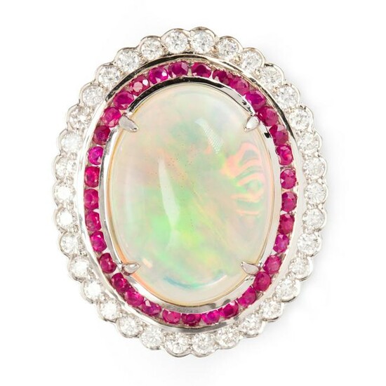 An opal, ruby, diamond and fourteen karat gold ring