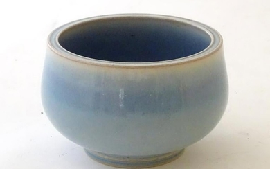 An unmarked high fired blue glazed bowl. Approx 3''