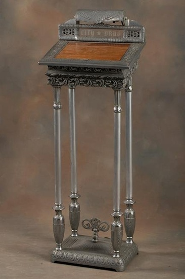 Antique Registry Stand with etched glass panel marked "CITY-DRUG", four heavily embossed metal