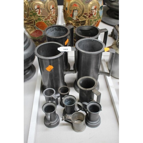 Assortment of antique & later pewter measures, approx 19cm H...