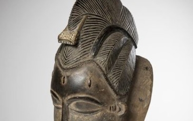 BAOULE, Ivory Coast. Female mask "Kpan" with rounded...